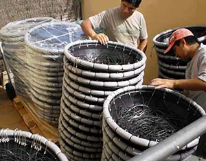 Packing 250 line baskets for a development program in Angola